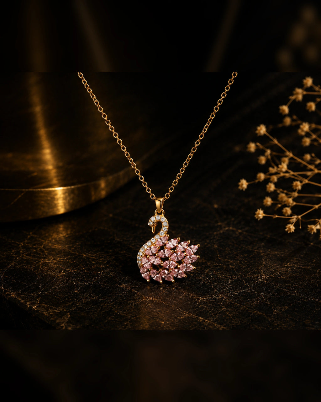 Swan necklace in gold and pink, worn